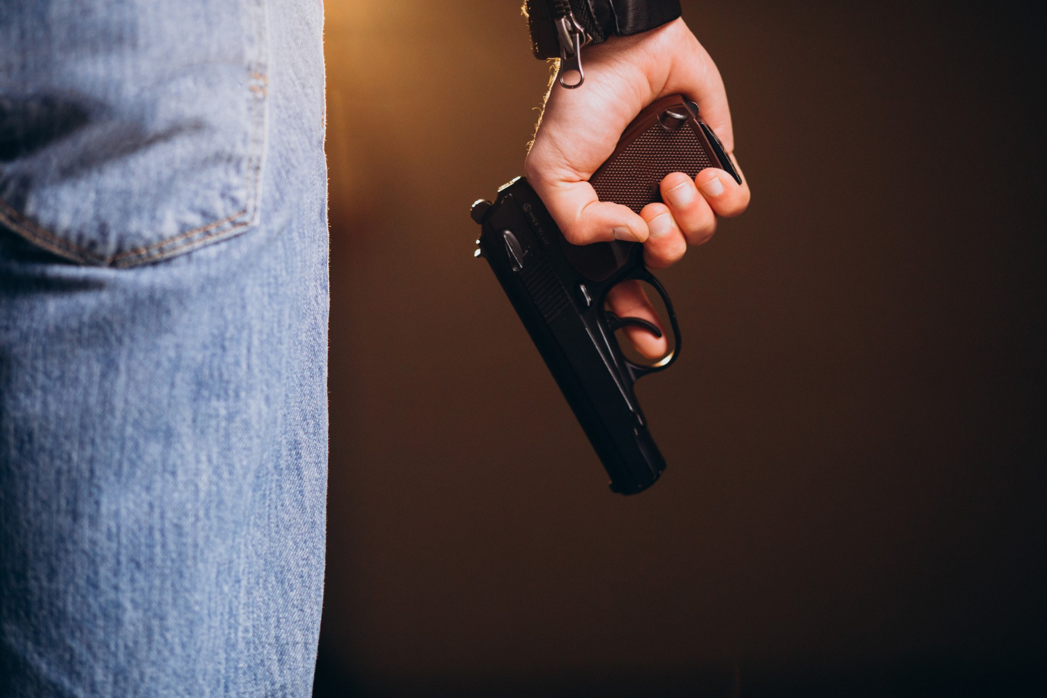 handsome-man-actor-posing-studio-with-weapon