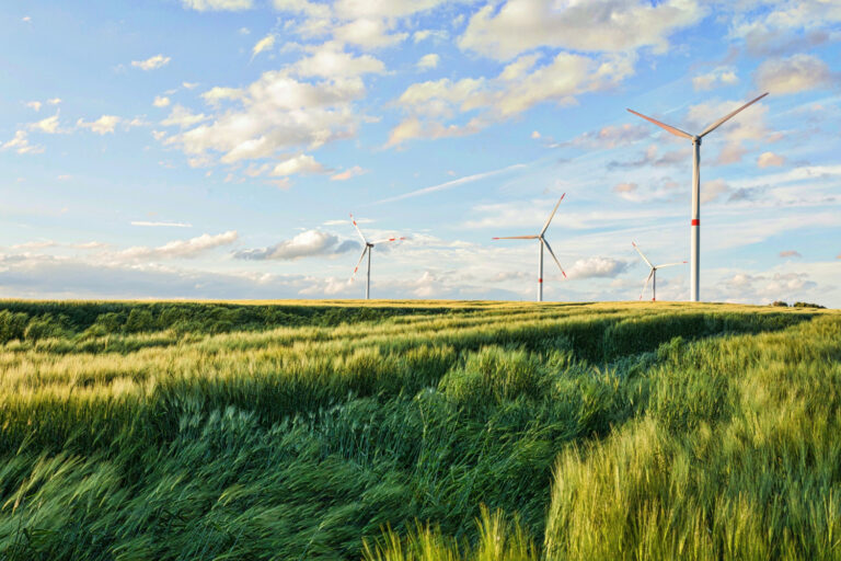 beautiful-shot-wind-turbines-cloudy-sky-eiffel-region-germany