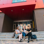 people-posing-entrance-college